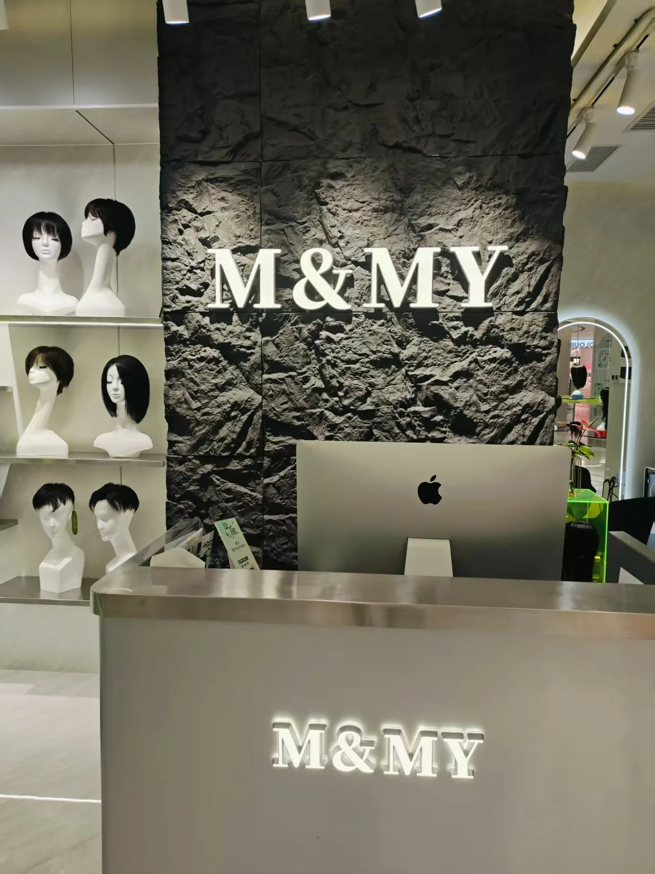 M&MY Shenzhen Guomao store reception desk and illuminated brand wall