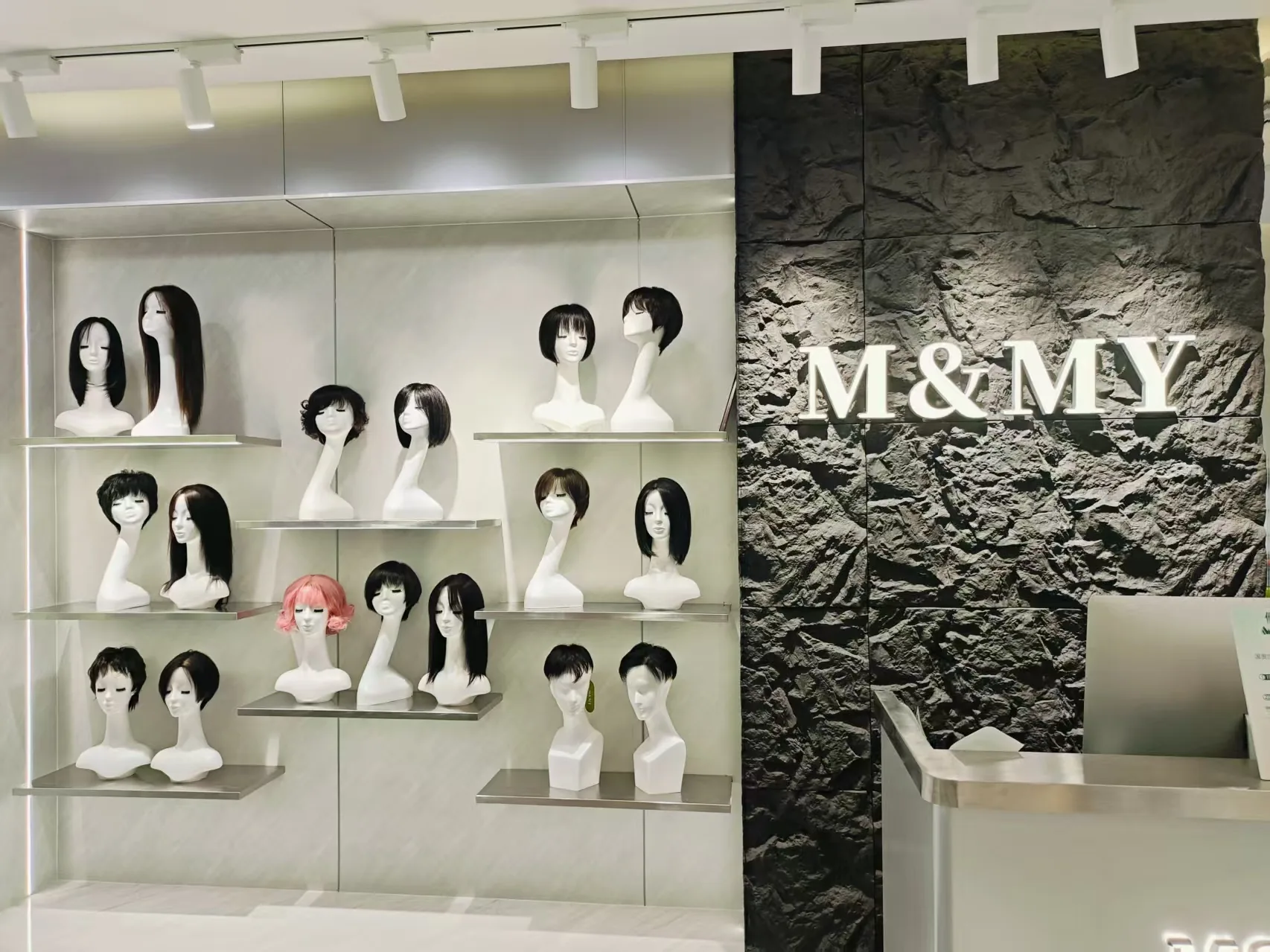 M&MY Shenzhen Guomao store reception desk and illuminated brand wall